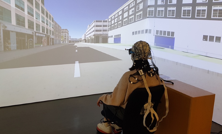 A participant wearing the mobile EEG system in our cave automated virtual environment