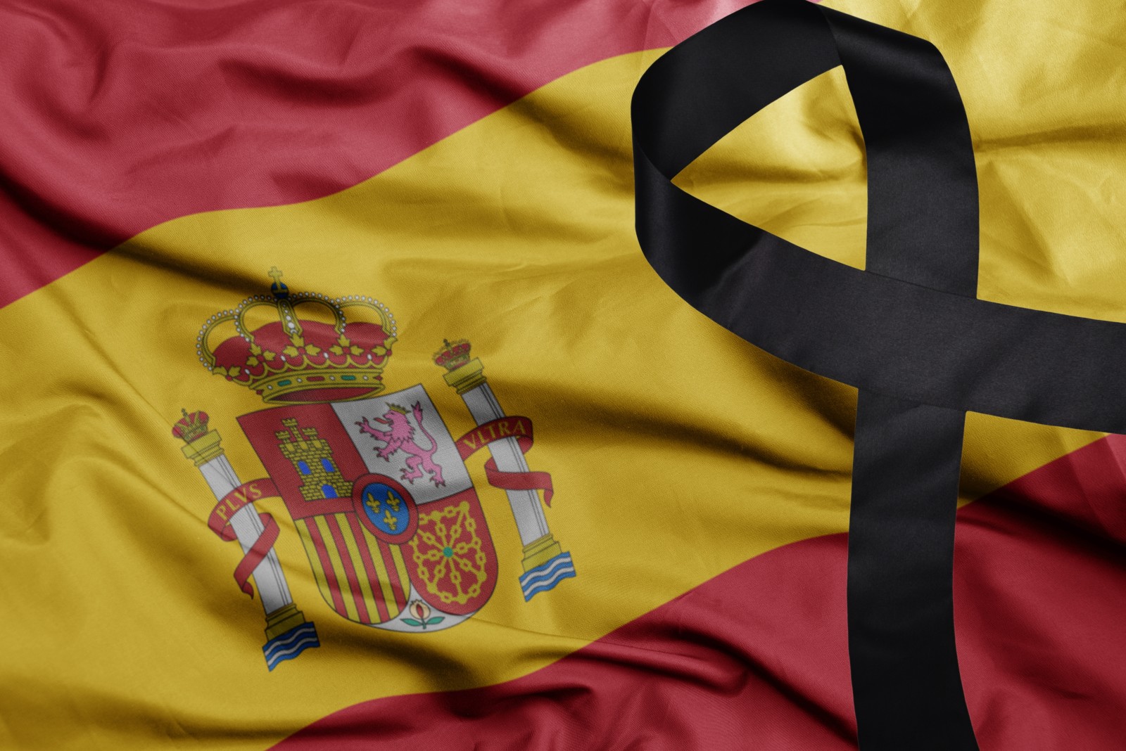 Spanish flag with black sorrow ribbon