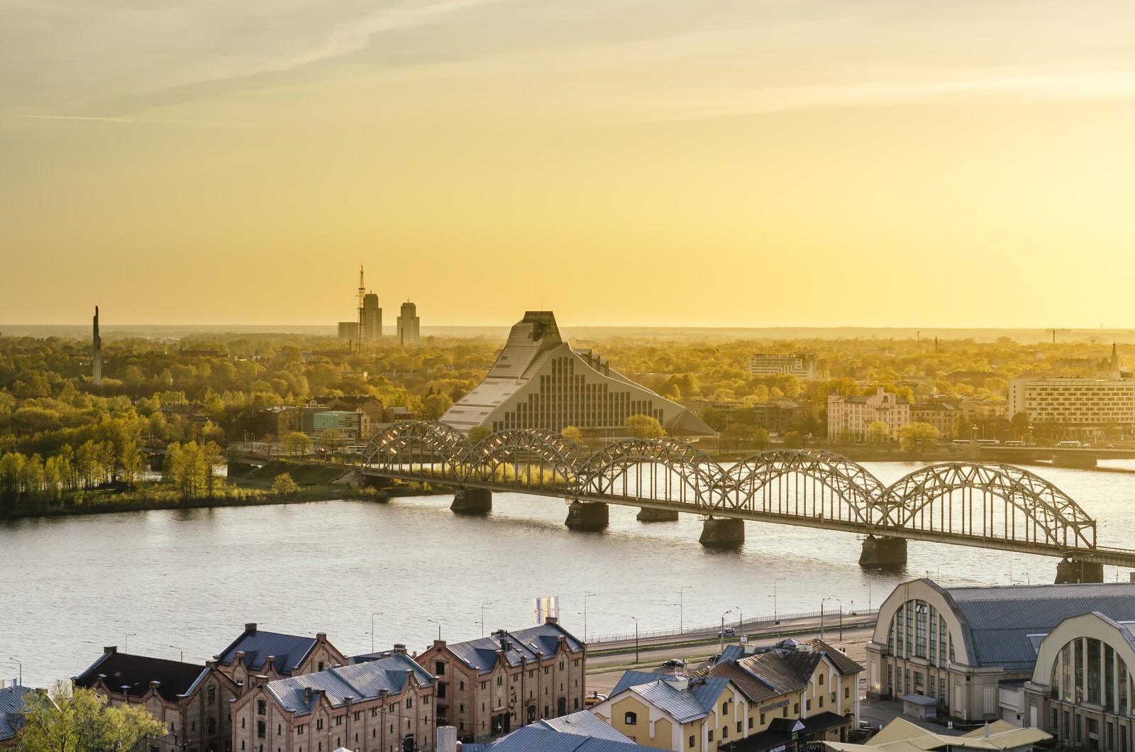 Panoramic view of Riga, the railway bridge and library.