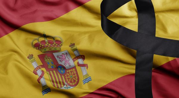 Spanish flag with black sorrow ribbon