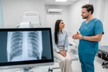 A doctor consults a patient. X-ray of lungs.