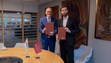RSU Rector Prof. Aigars Pētersons and Acting Director of the Jūrmala Football School, Kaspars Gorkšs pose holding their agreement
