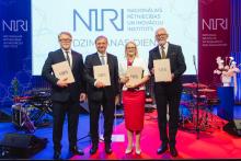 RSU Rector posing with members of the New National Research and Innovation Institute